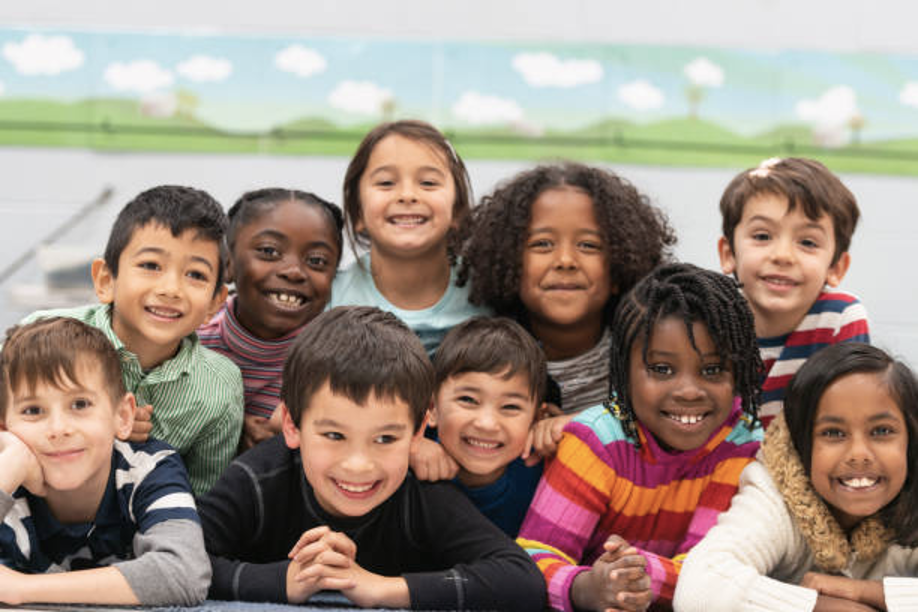 Group of diverse children looking at camera and smiling